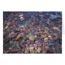 Stones in the lake at Glacier National Park Greeting Cards