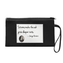 Storms make the oak grow deeper roots. wristlet clutches