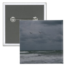 Stormy ocean with birds flying button