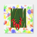 string of red peppers green back fridge magnet