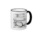 Studio shot of eyeglasses on eye chart coffee mug