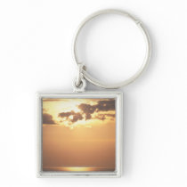 Sun goes down on the ocean key chain