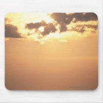 Sun goes down on the ocean mouse pad