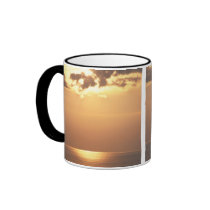 Sun goes down on the ocean mug