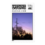 Sun Setting Behind Power Lines postage