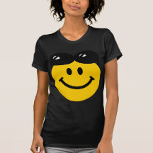 Sunglasses perched on top of head smiley face shirt