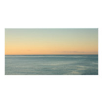 Sunrise and serene ocean photo card