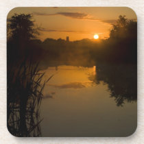 Sunrise by a lake drink coasters
