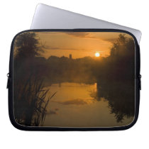 Sunrise by a lake laptop sleeve
