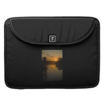 Sunrise by a lake MacBook pro sleeves