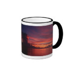 Sunset at sea with dark clouds mugs