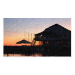 sunset by the lake waterfront with deck buildings business card
