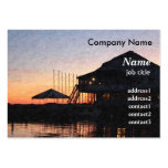 sunset by the lake waterfront with deck buildings business card template