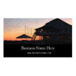 sunset by the lake waterfront with deck buildings business card