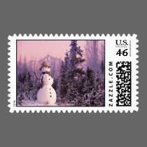 Sunset Snowman in the Winter Mountains postage