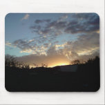 A photograph of a sunset, the glow of the sun casting highlights onto the clouds Sunset with clouds mousepad