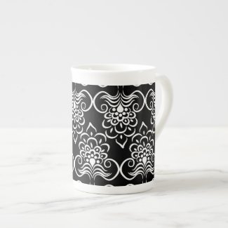White Swirls Floral Pattern On Black Tea Cup