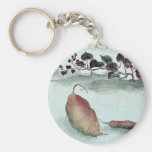 Sweet potato with plant growing in the background key chains