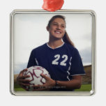 teen girl soccer player holding soccer ball ornament