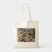 Texture of the rock mountain with blue sky tote bags