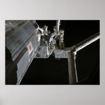 The robotic arm of the Japanese Experiment Modu Poster