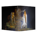 The Space Shuttle Discovery at Launch Pad 39A binders