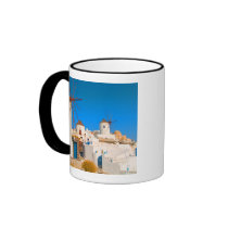 The white buildings and the windmills on the coffee mug