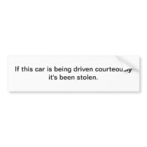 This car being driven courteously - bumper sticker
