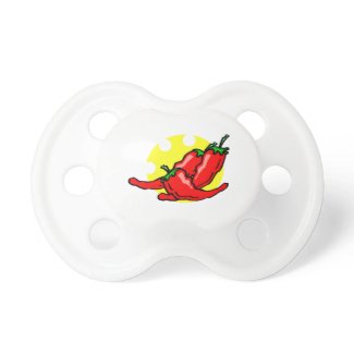 Three peppers lying in eaten sun baby pacifiers