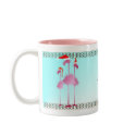 Three Pink Christmas Flamingos mugs by Lotacats Three Pink Christmas Flamingos mugs