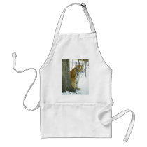 Tiger Cub In Snow Peeking Around Tree Aprons