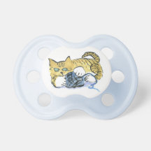 Tiger kitten keeps his eyes on the yarn baby pacifiers