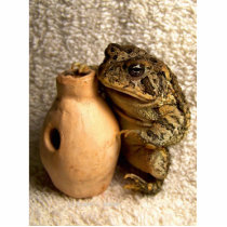 Toad frog holding miniature udu photograph cut out