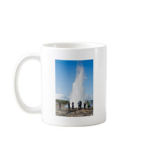 Tourist watching Strokkur mugs