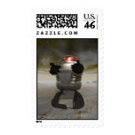 Toy robot on an Alien planet Postage