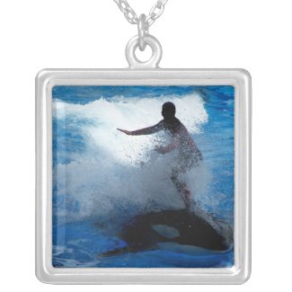 Trainer riding on killer whale orca photograph necklace