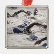 Triathletes competing in swim leg of triathlon. christmas ornament