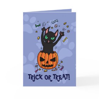Trick or treat black cat jumping from pumpkin