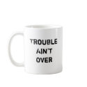 Trouble Ain't Over Mug by Pribek Trouble Ain't Over Mug