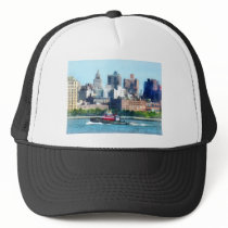 Tugboat Against Manhattan Skyline hats