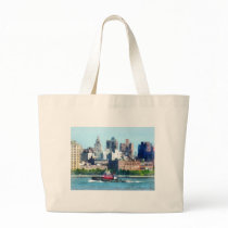 Tugboat Against Manhattan Skyline bags