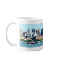 Tugboat Against Manhattan Skyline mugs