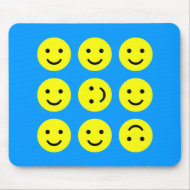 Tumbling Smileys - On Mid-Blue mousepad