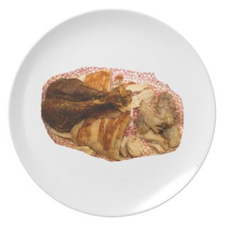 turkey leg and meat on red white platter plate