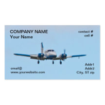 Twin airplane on landing approach business card