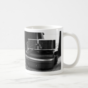 Two black guitar cases in bw coffee mugs