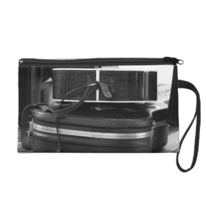 Two black guitar cases in bw wristlet purse