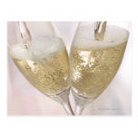 Two champagne flutes being filled with sparkling post cards
