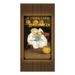 Two children reading ghost stories photo card