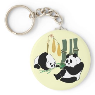 Two Cute Pandas eat bamboo in tropical forest Keychains